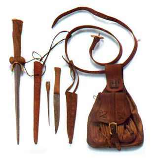 Belt-Bag:     A soldier had to carry his personal belongings with him were ever he went, so he carried only a few things. here is a dagger and some eating utensils.